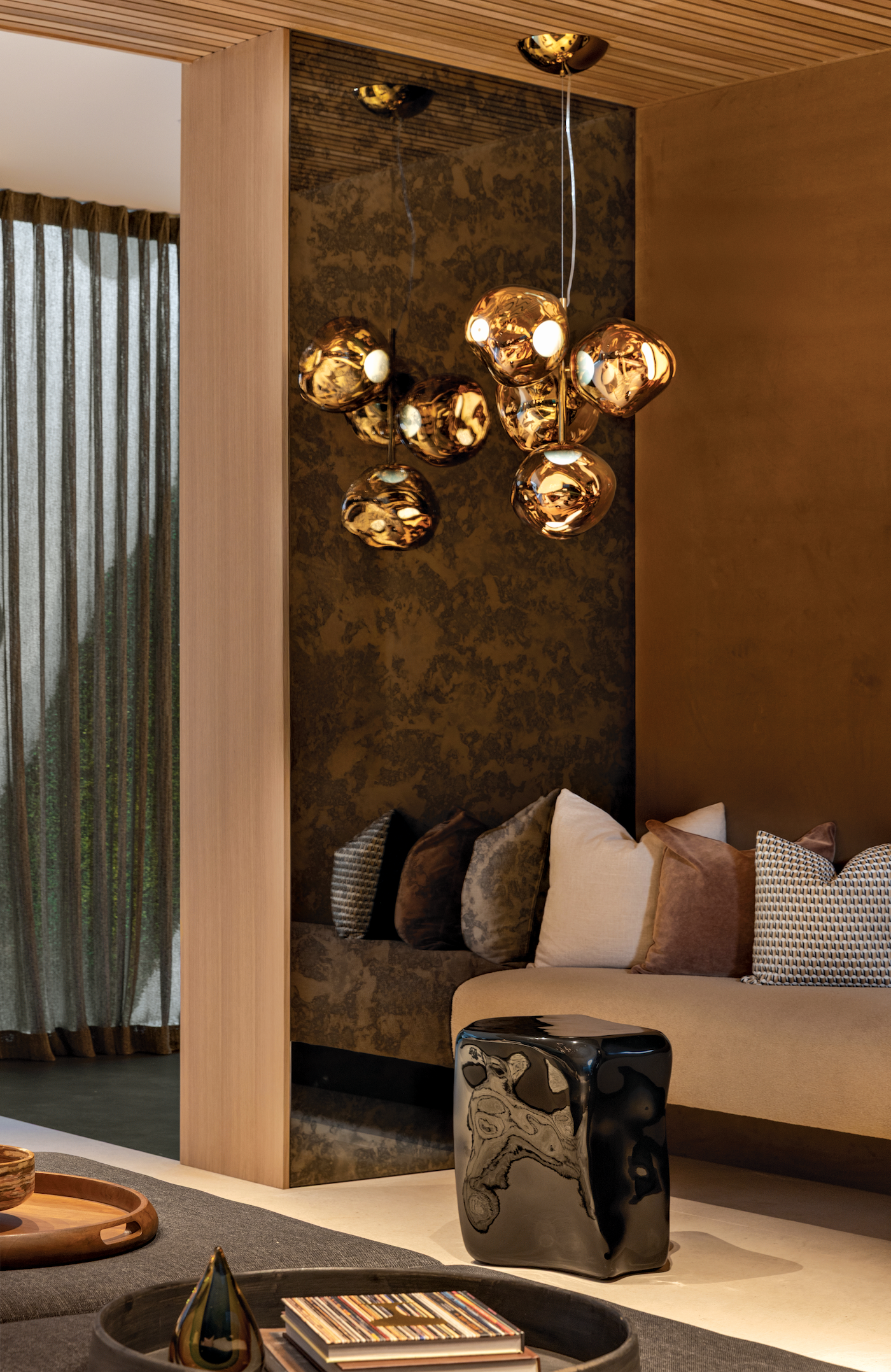 Cigar lounge featuring statement lighting and rich textures for an intimate atmosphere.
