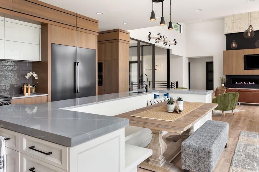 Kitchen with built in banquette seating that overlooks the living area.