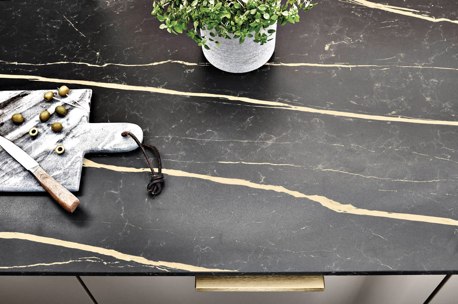 black stone table with a cutting aboard resting on it