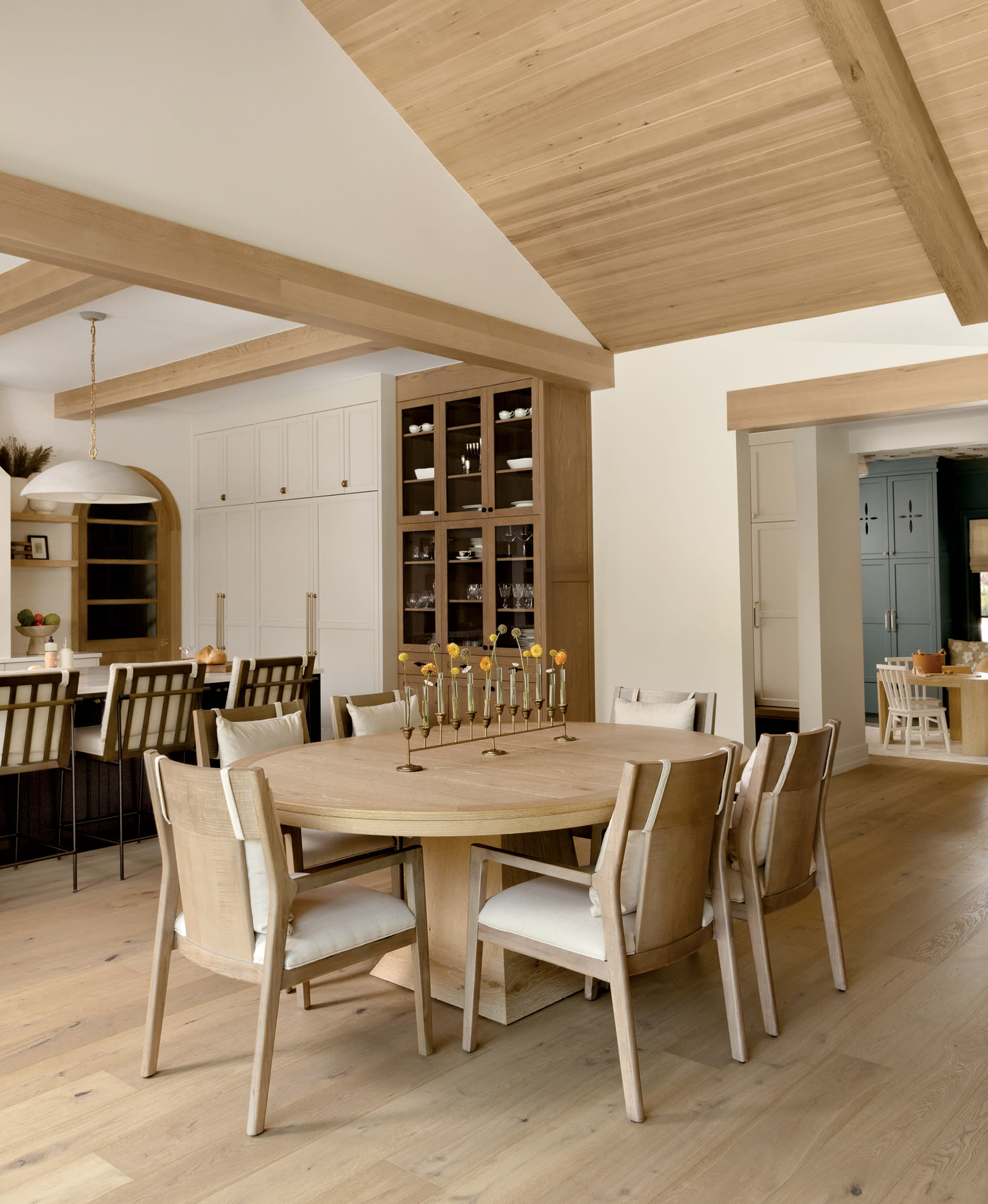 contemporary dining room in light neutrals with an Arhaus table