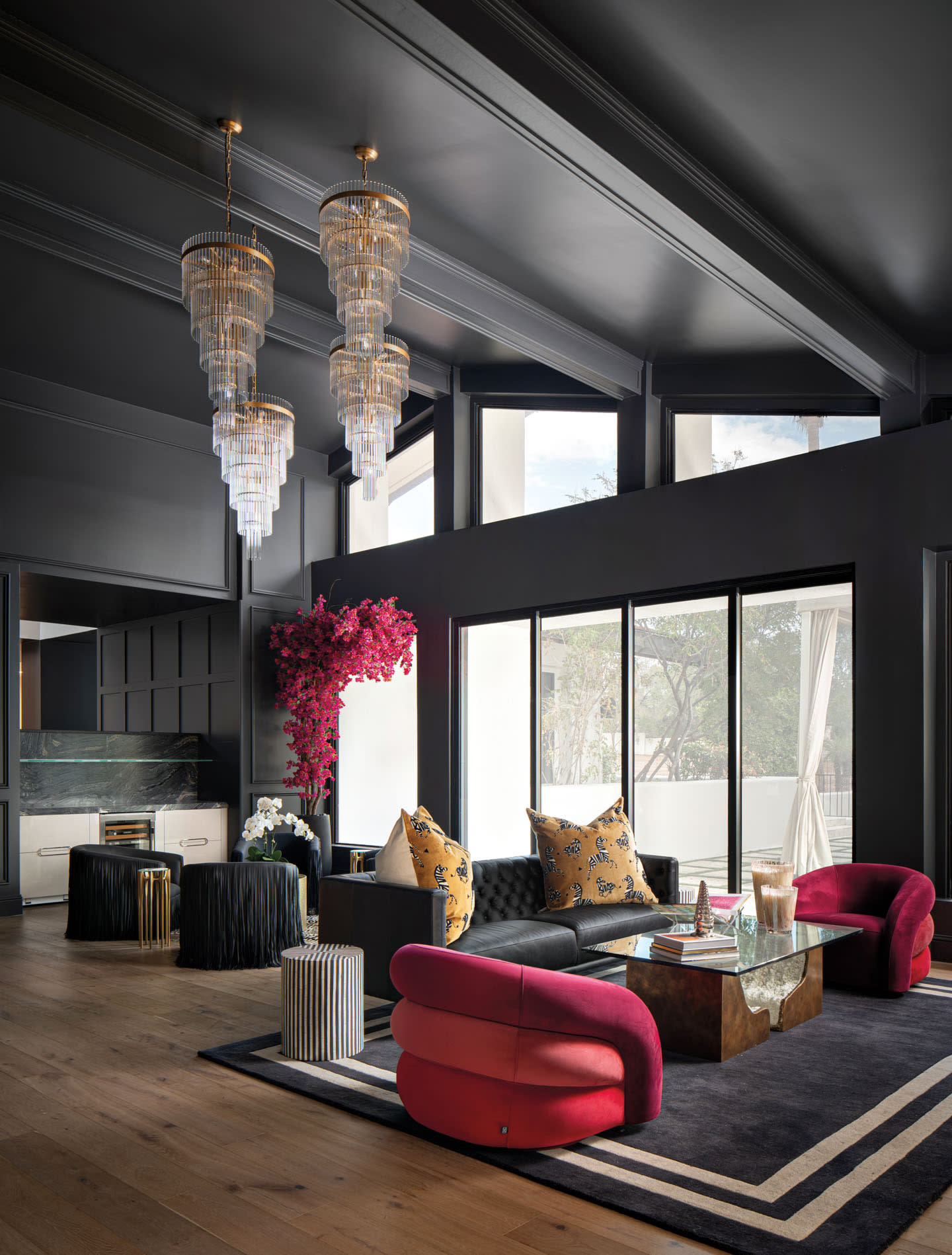 modern living room with black walls and red accents