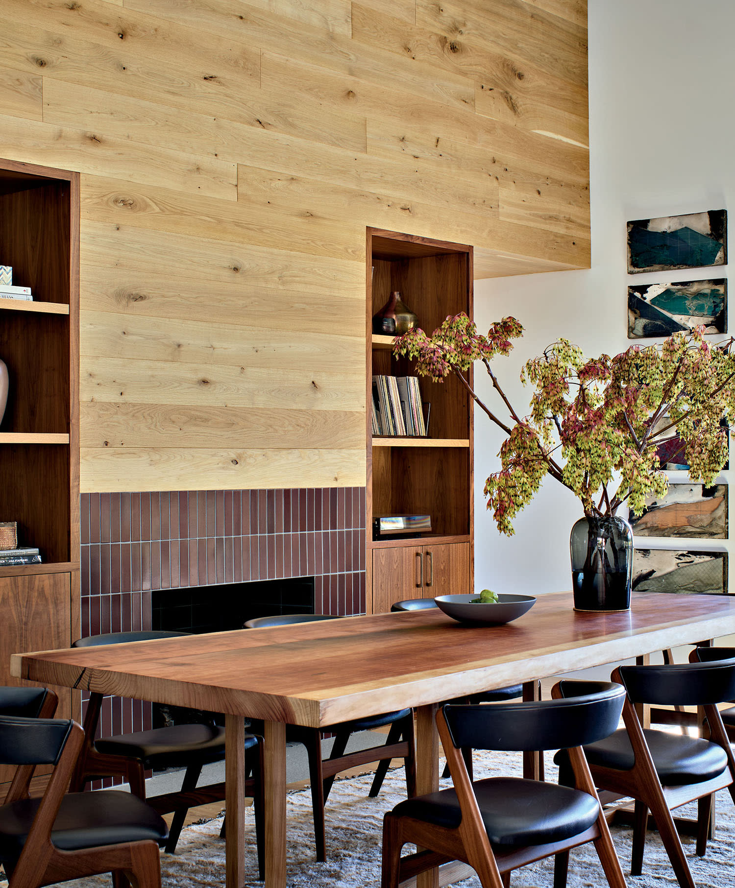wood-surrounded dining room with a walnut table and chairs