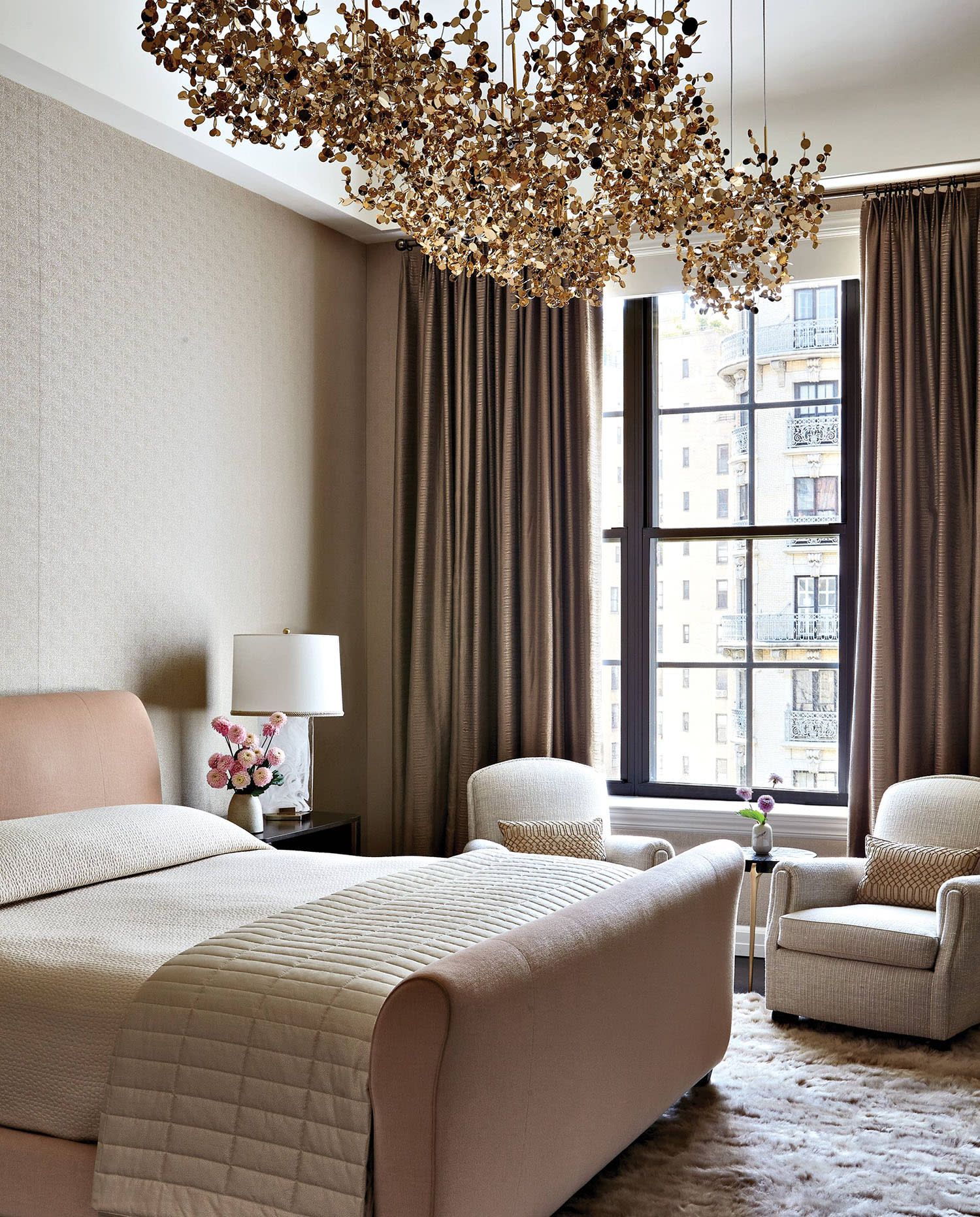 elegant bedroom with a Terzani ceiling fixture