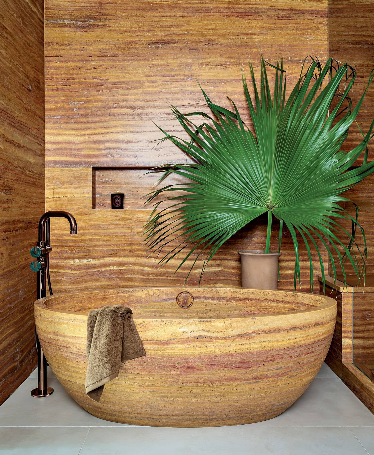 bathroom with red travertine tub and walls