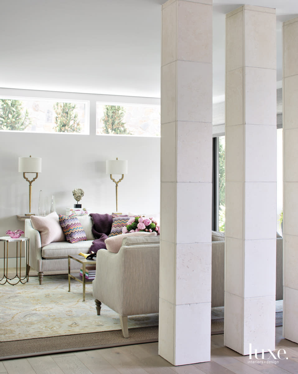 neutral sitting room with purple pink accent pillows