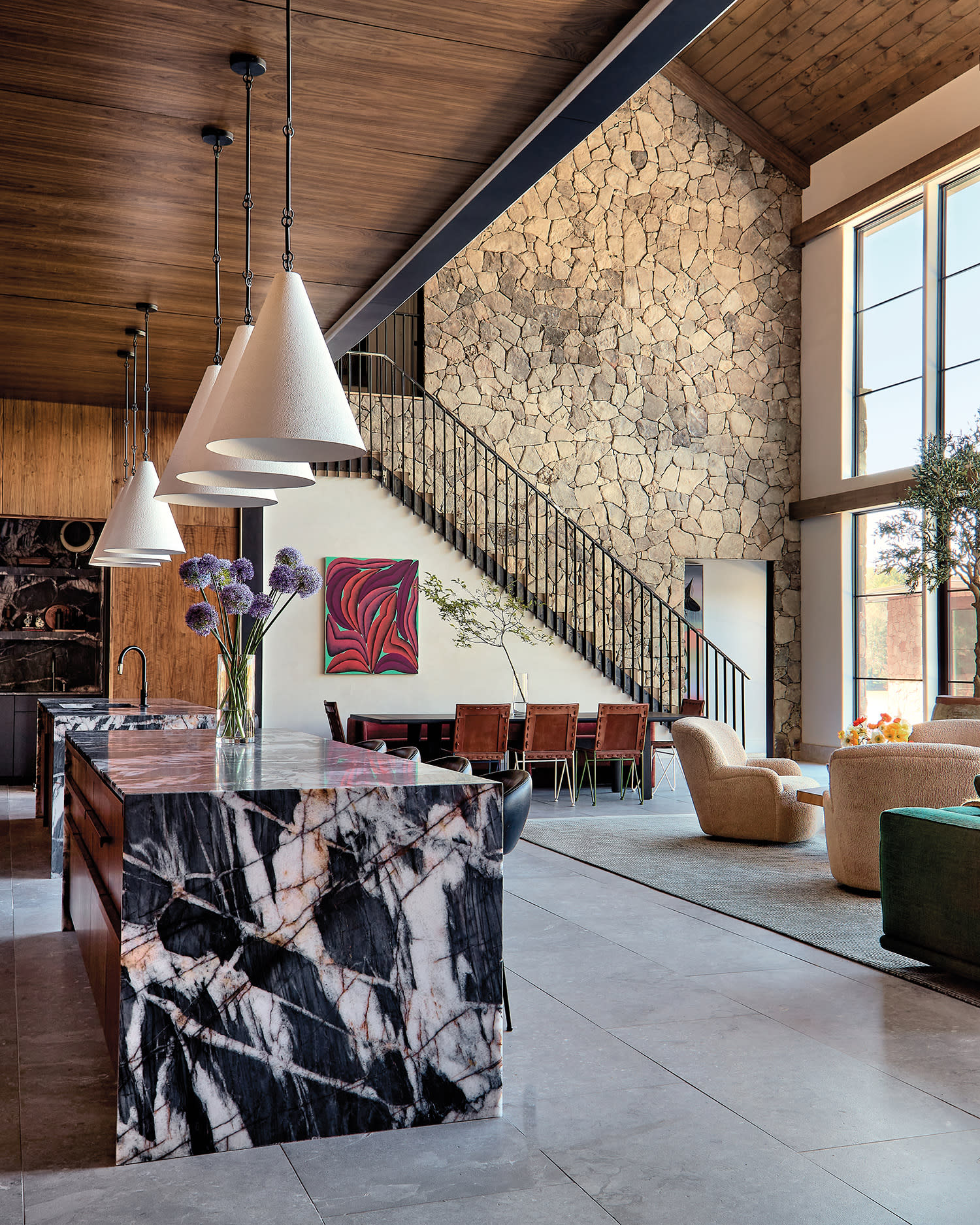 modern rustic open-concept kitchen with a quartzite island