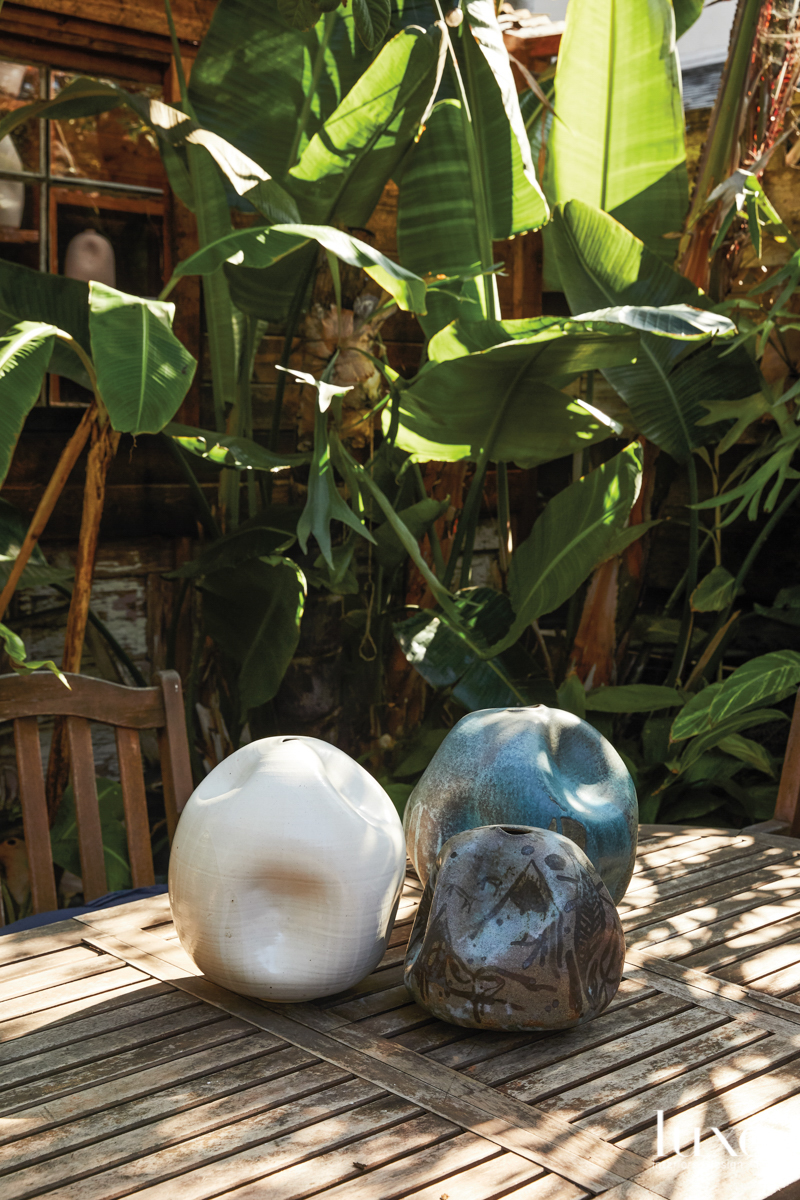 A trio of ceramic vessels on a table