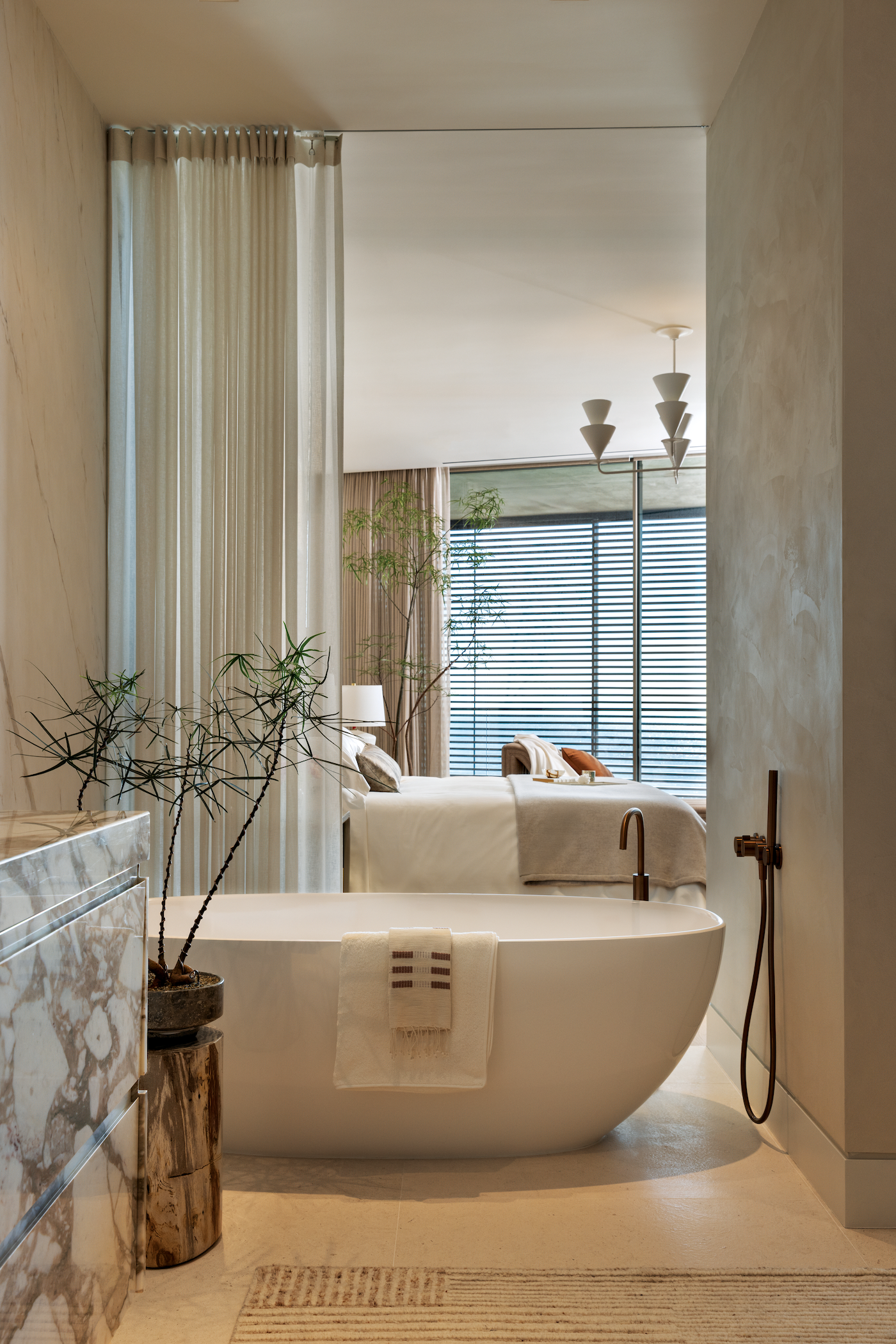 Primary bathroom with freestanding luxury soaking tub overlooking the ocean.