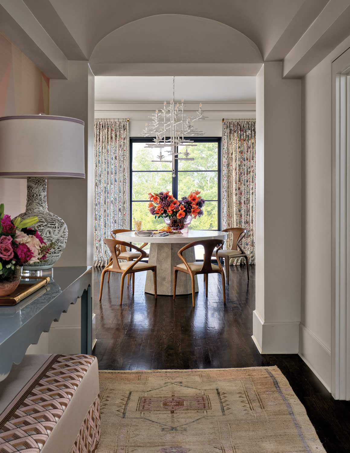 breakfast area with a round dining table overlooking lush green views