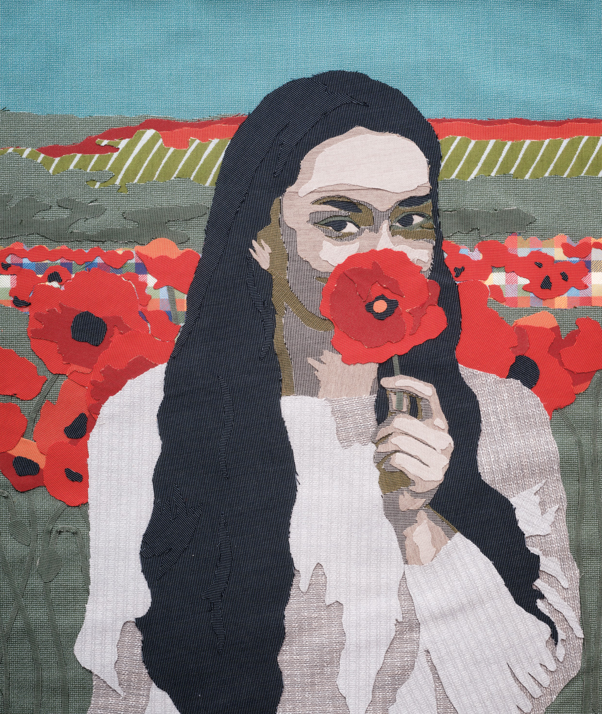 Part of the Maggie Dillon x Sunbrella fabric collection, woman with long hair holding up red flower