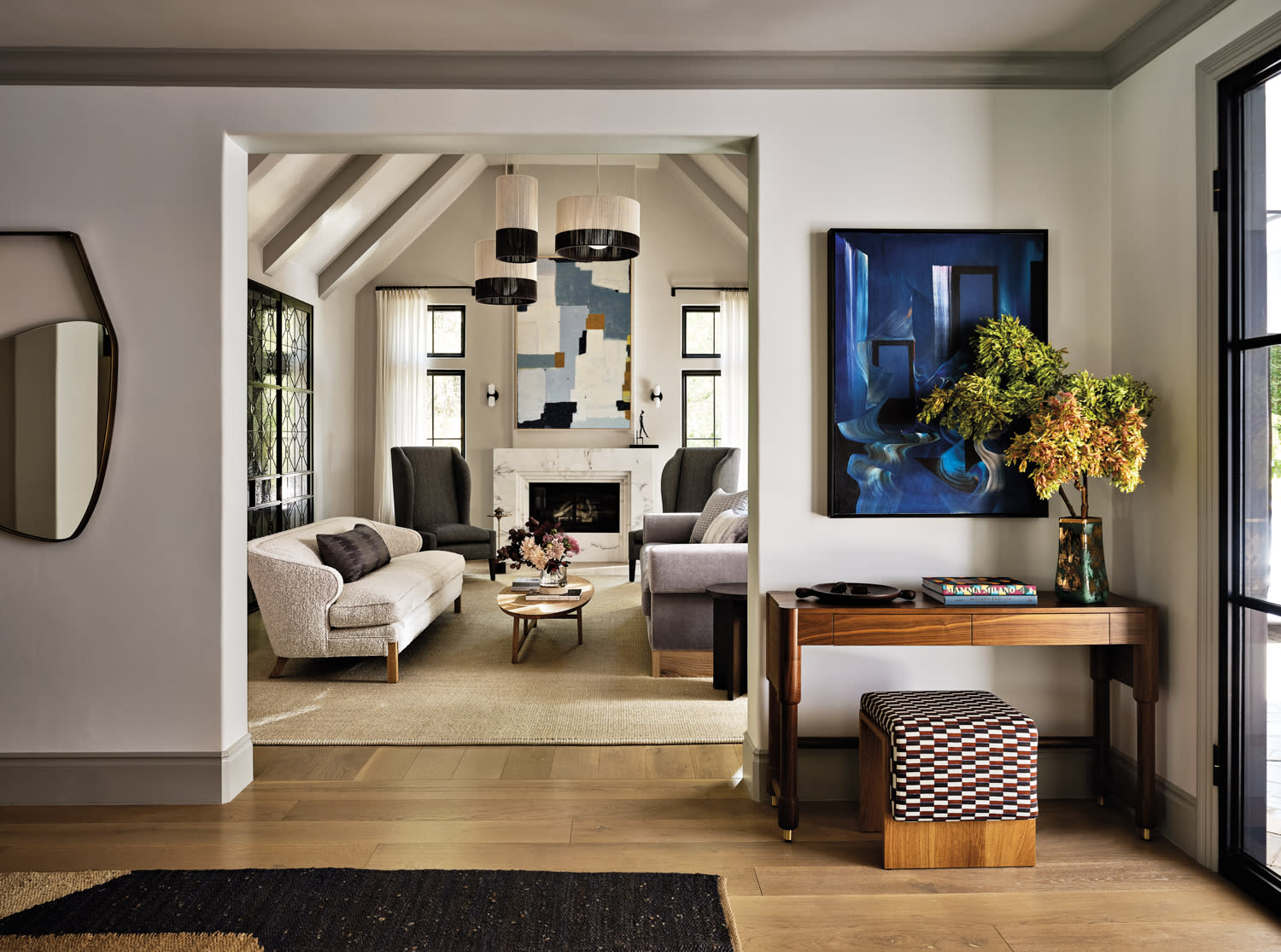 contemporary entryway with a large blue abstract artwork