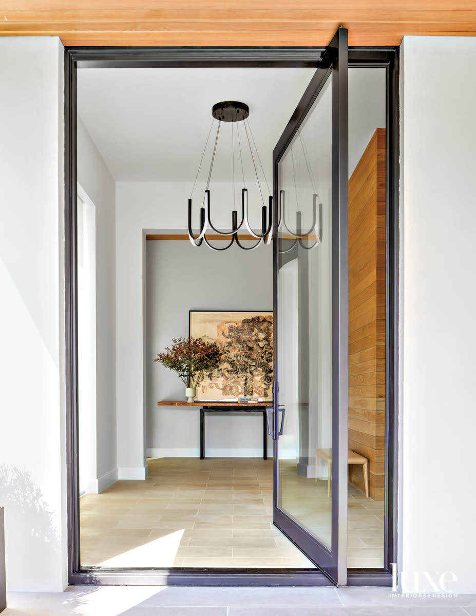 entry with glass door and white oak wall