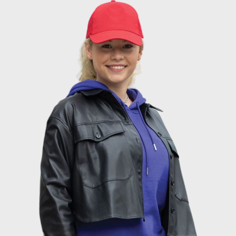 Woman smiling while wearing a red five-panel trucker cap