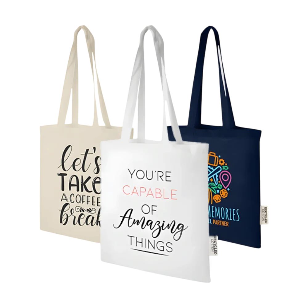 Three Madras GRS recycled cotton tote bags with colourful printed designs