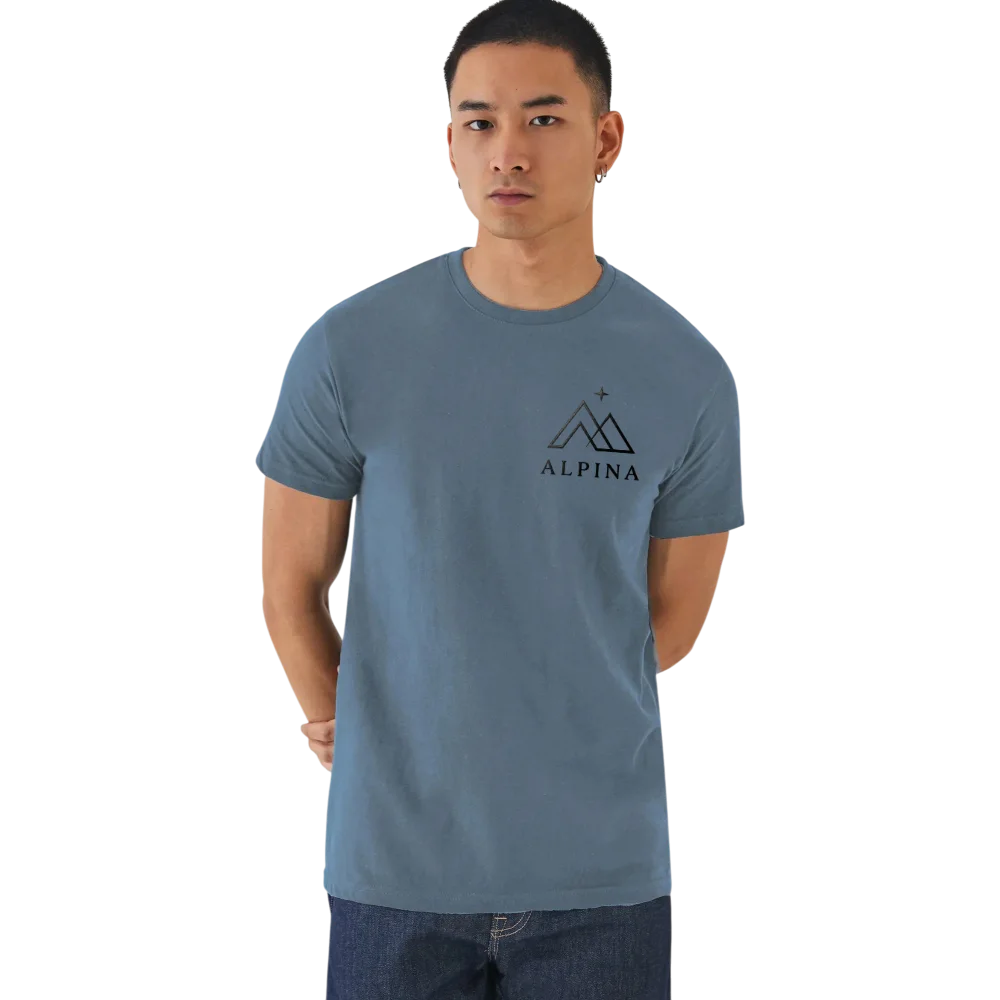 Man wearing slate blue B&C E190 t-shirt with black Alpina mountain logo