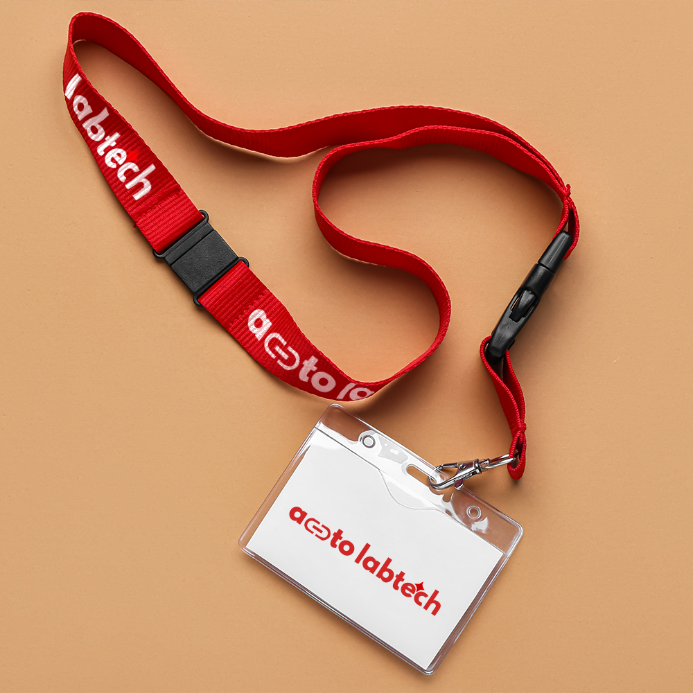 Red lanyard with custom print and clear ID card holder with badge