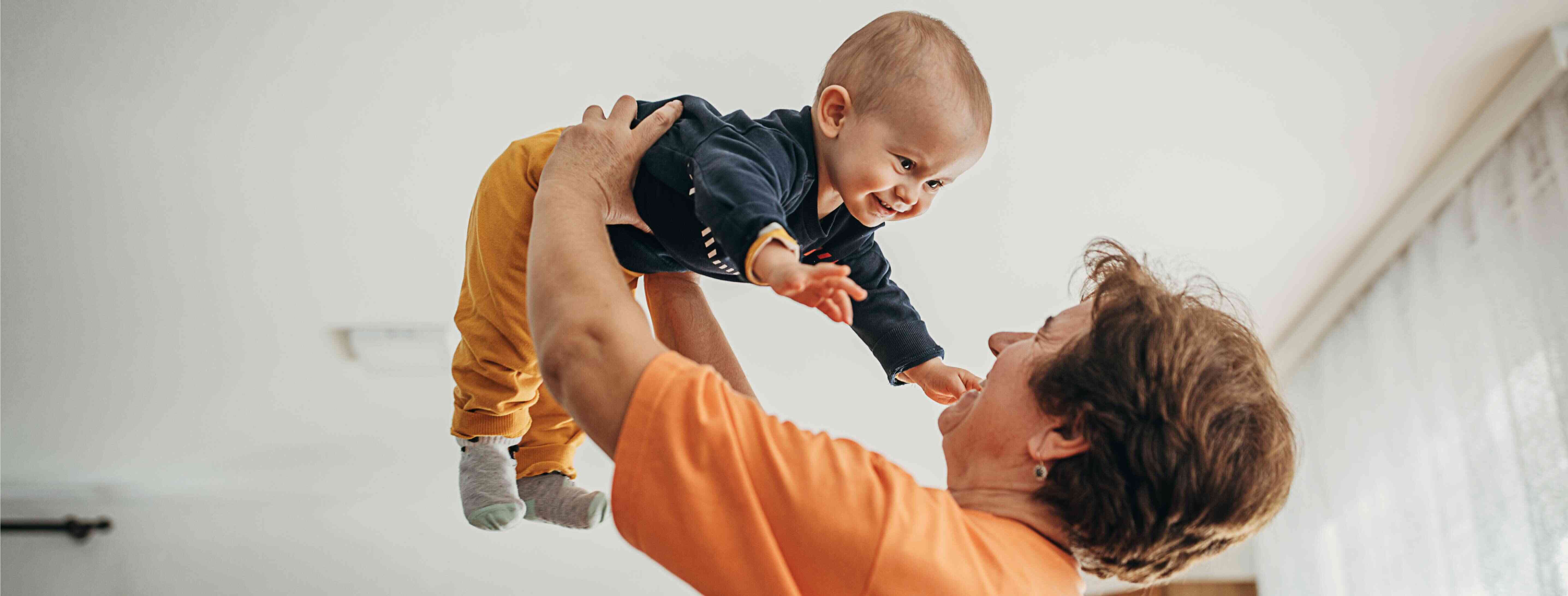 German-speaking babysitter playing with a baby