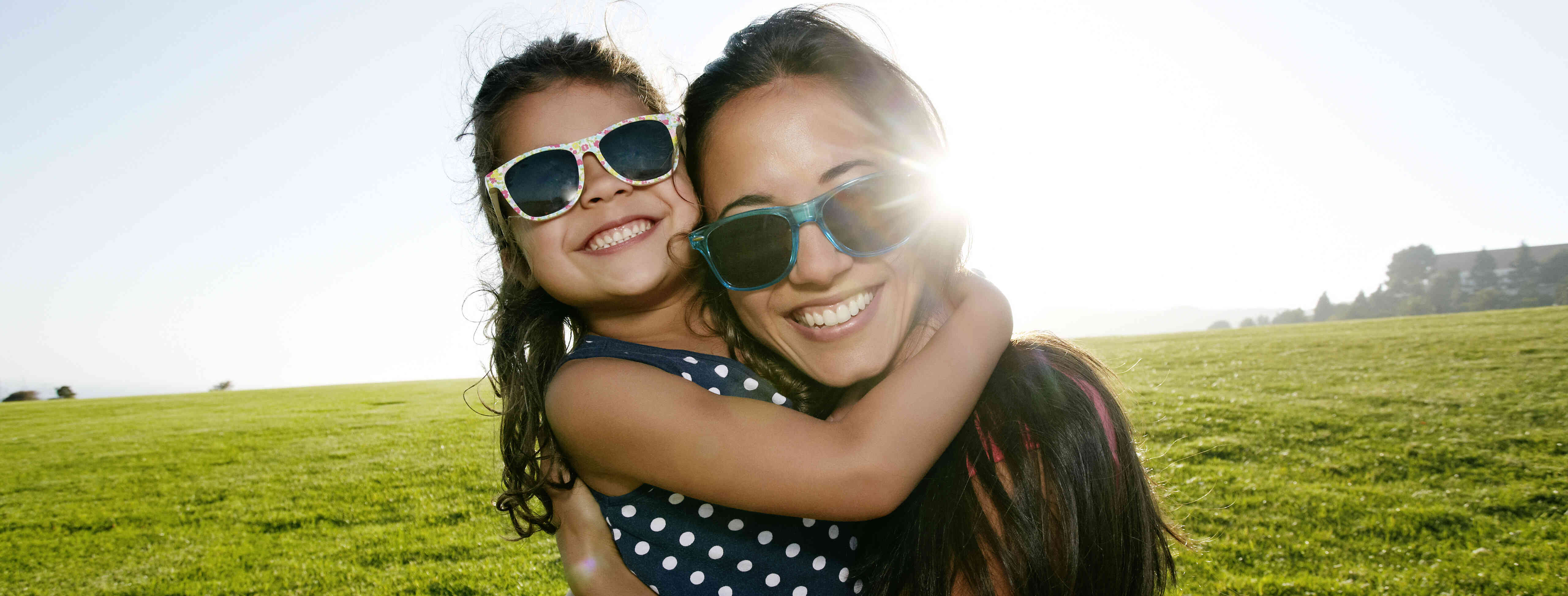 Child care provider and girl enjoying the outdoors.