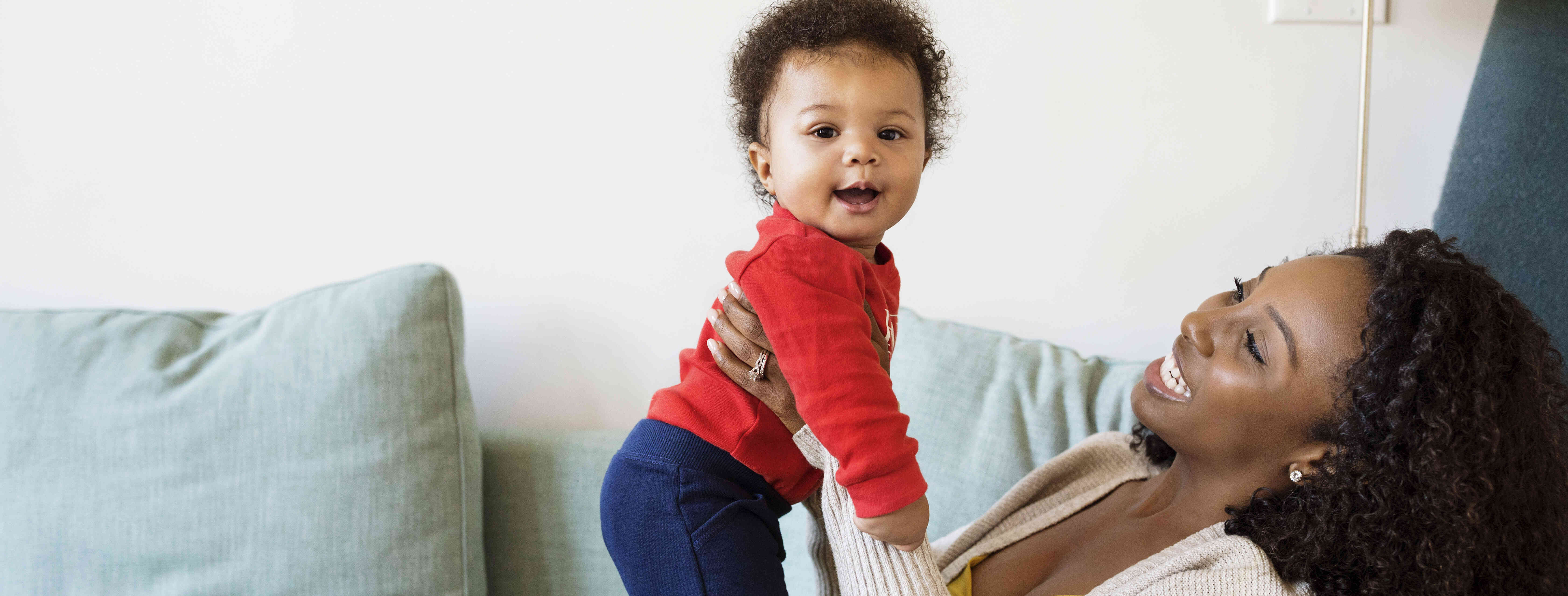 Temporary child care provider playing with a baby.