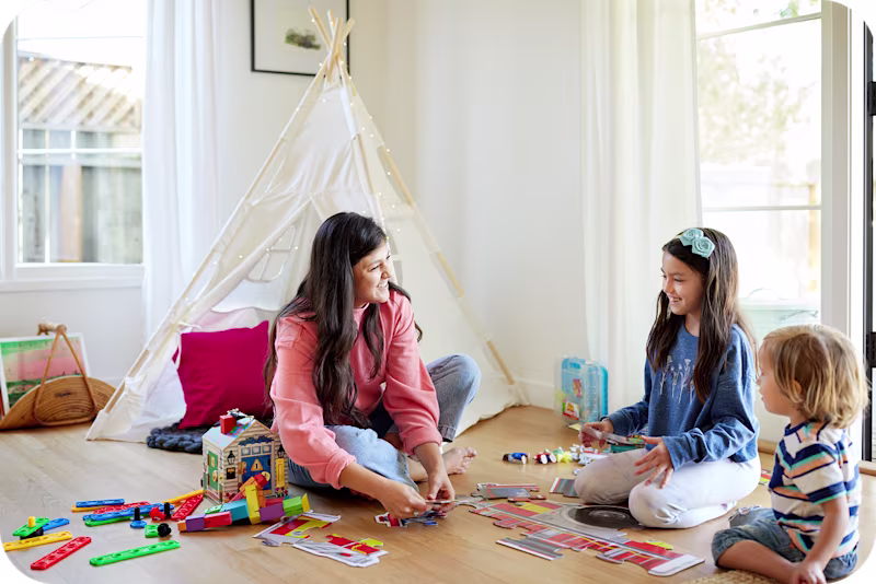 Caregiver playing with two children