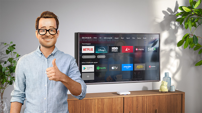 Boxer-Robert står framför en tv-skärm och gör tummen upp