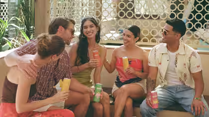 A group of people sitting together and enjoying Casa Famosa Hard Soda