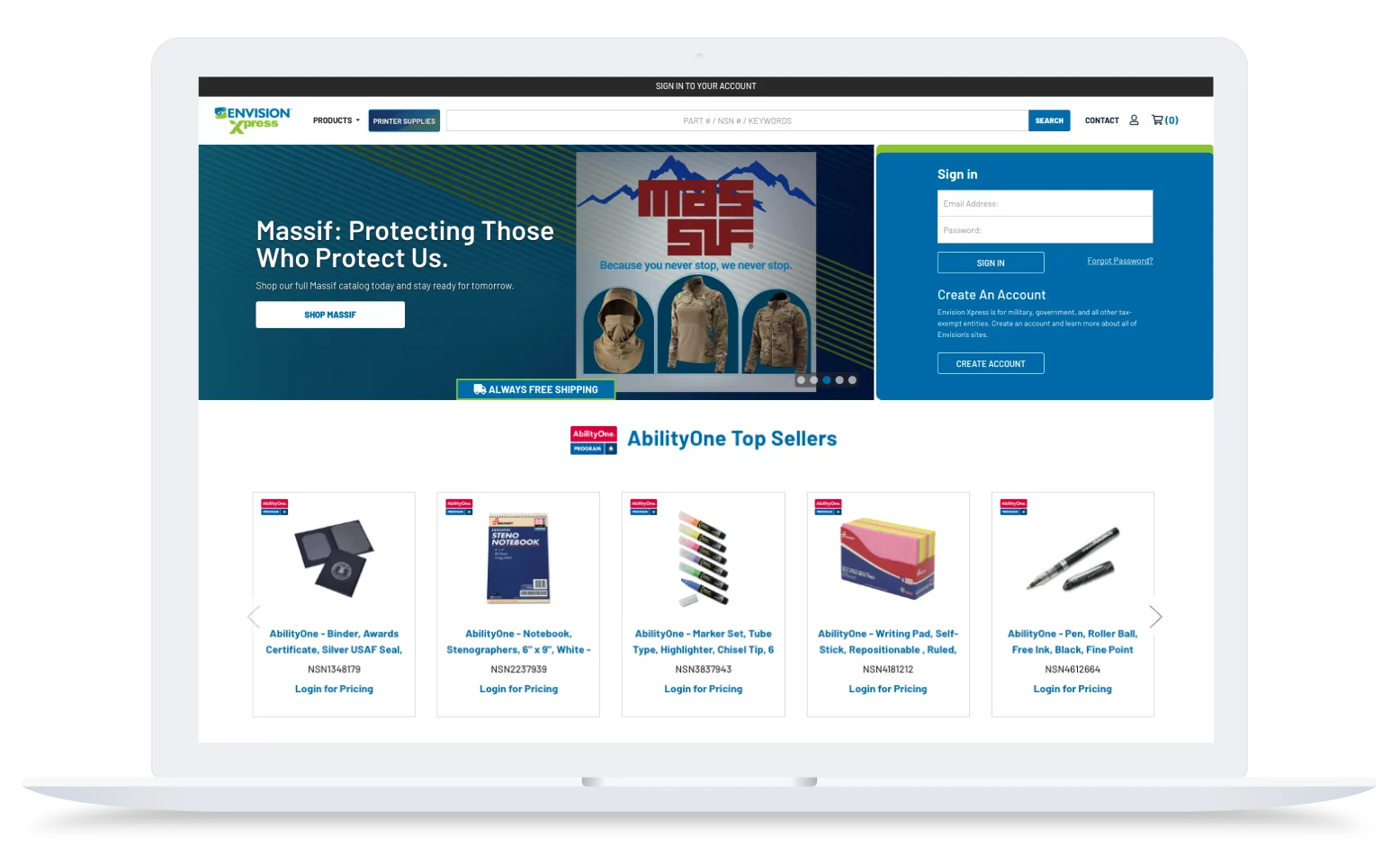 Laptop showing Envision Xpress website with Massif promo banner, blue sign-in panel, and AbilityOne top sellers products.