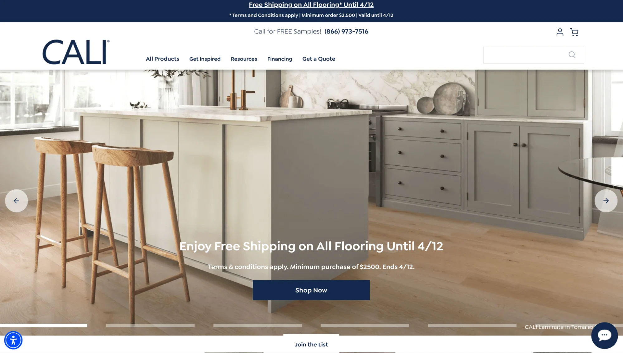 Modern kitchen with granite countertop, and two bar stools sitting on laminate flooring