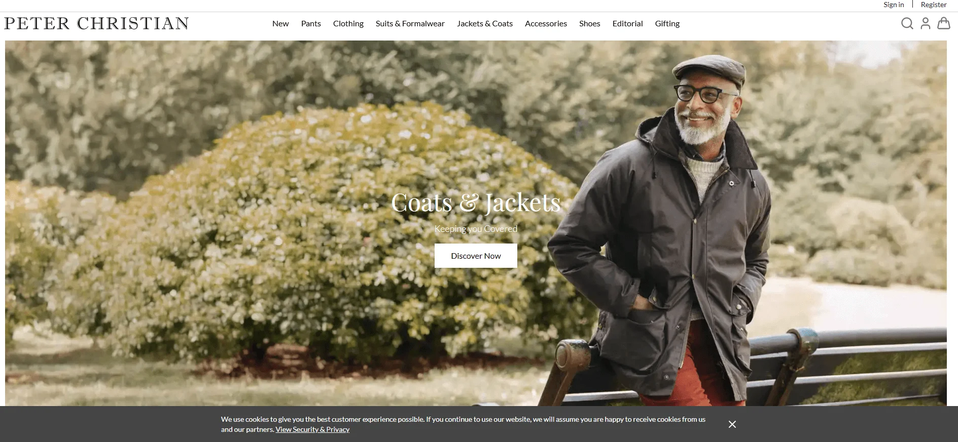 The Lifestyle Shot: Man leaning against a park bench in a casual hooded jacket (Peter Christian website)