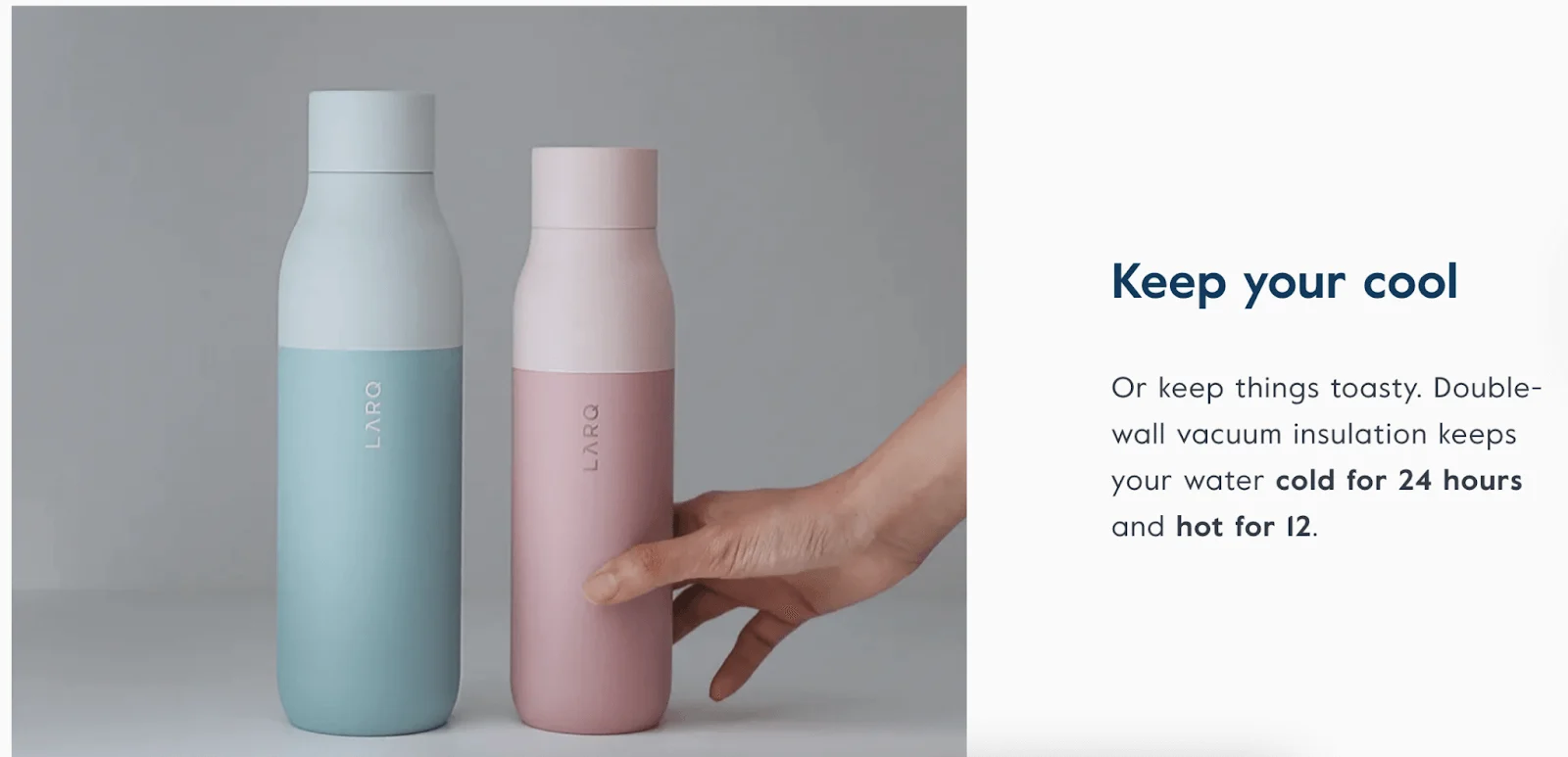 A hand reaches for a pink insulated water bottle next to a blue one, both labeled LARQ, on a gray background.