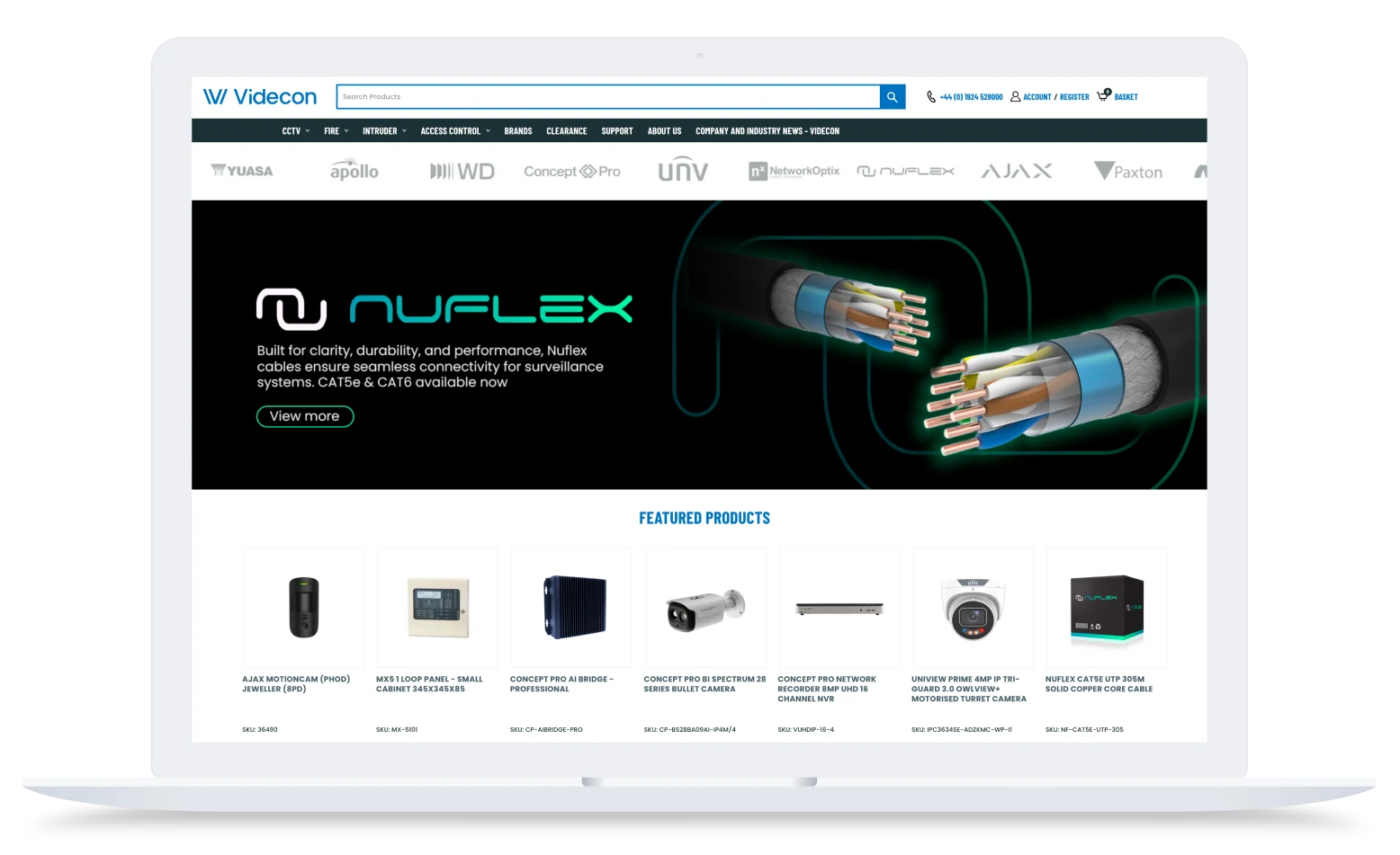 Videcon's BigCommerce storefront displayed on a laptop, showing the homepage with featured security products and brand navigation.