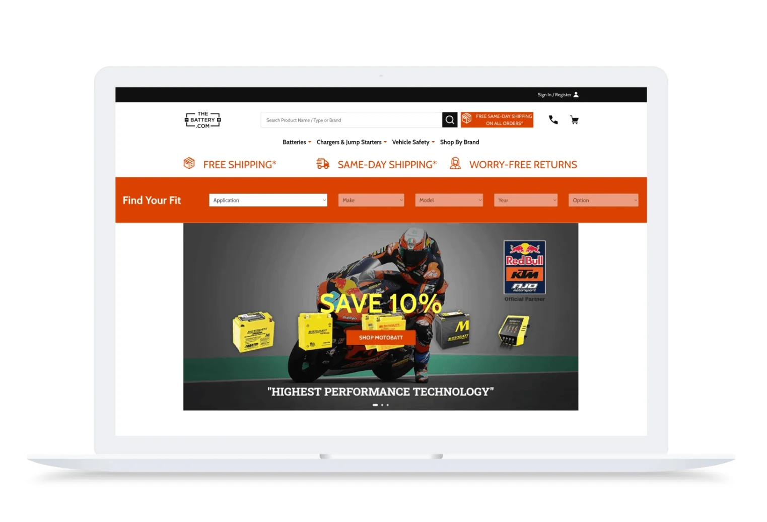 Laptop displaying TheBattery.com website with motorcycle racer and Save 10% promotion for Motobatt batteries.