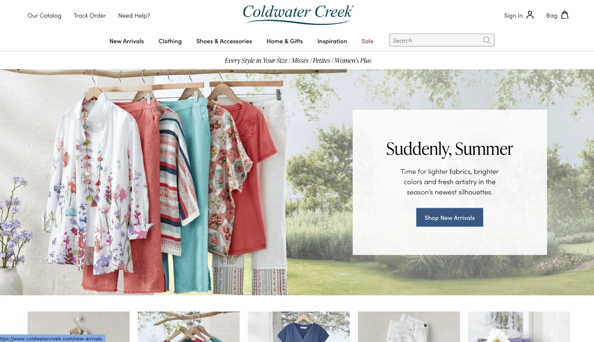 Coldwater Creek Homepage of Suddenly Summer clothing items hanging on an outdoor rack