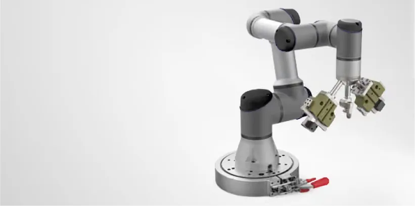 Gray and silver dual-arm robotic system with yellow-green grippers on white background, showing industrial automation equipment.