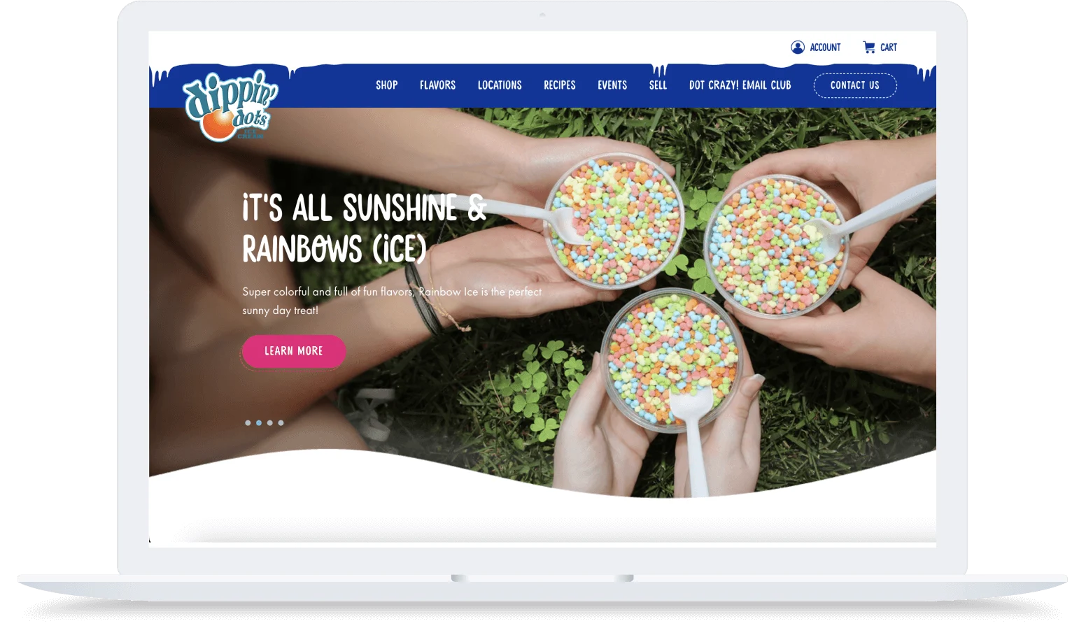 Three hands holding cups of colorful Dippin’ Dots ice cream with white spoons over green grass.