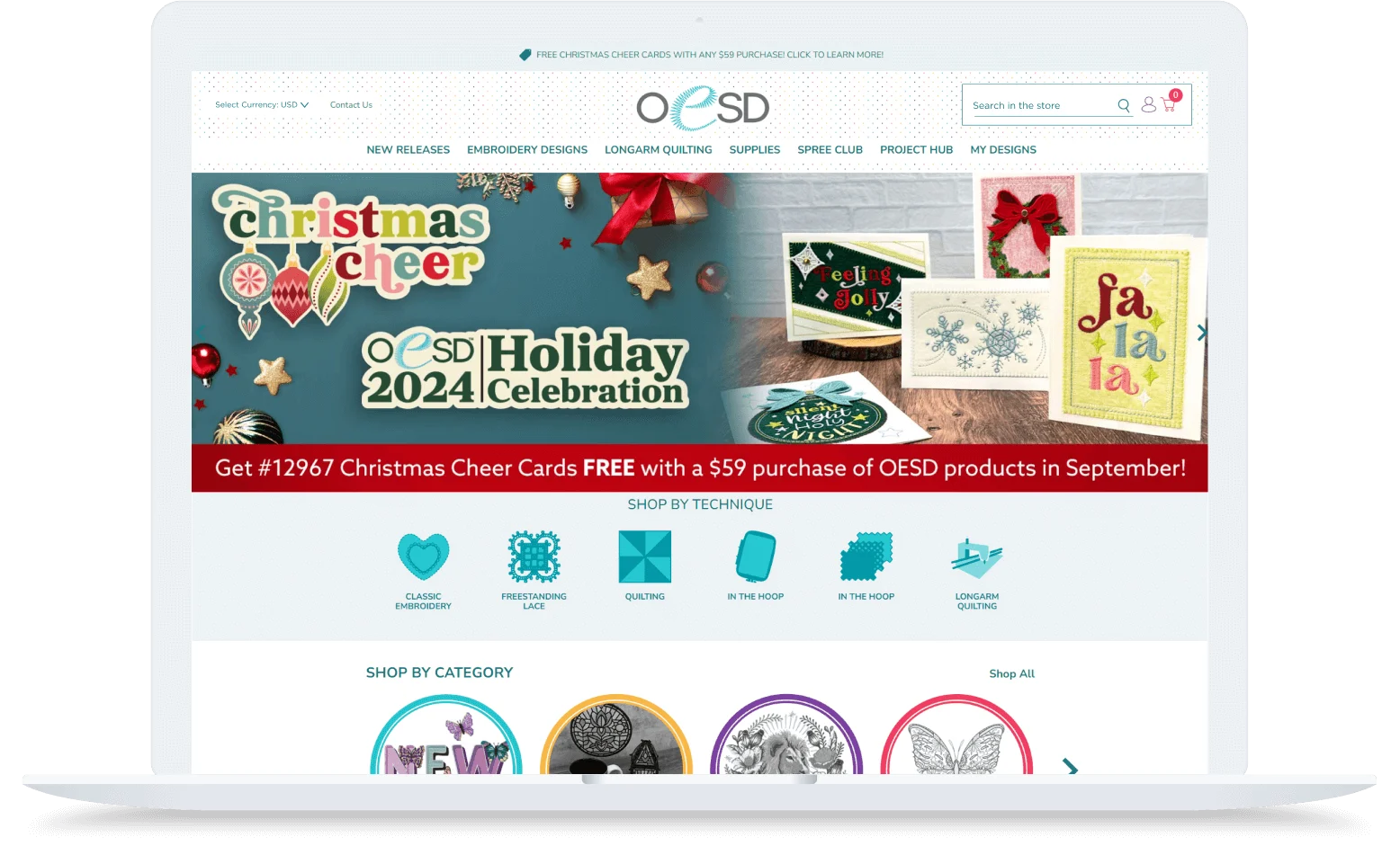 Laptop screen displaying the OESD website, promoting the Holiday 2024 Celebration and a free Christmas Cheer Card with a purchase.
