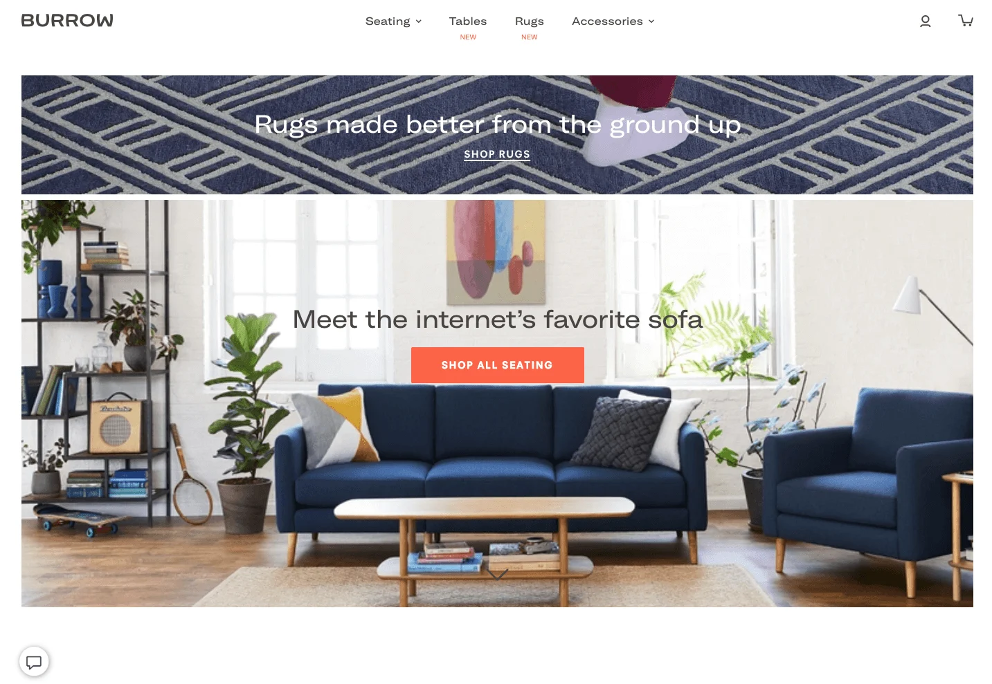 Modern living room with a blue sofa, armchair, coffee table, plants, and wall art in a bright, sunlit space.