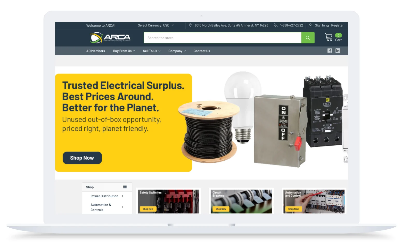 Laptop screen showing ARCA website with electrical surplus items, yellow banner, and shop now button.