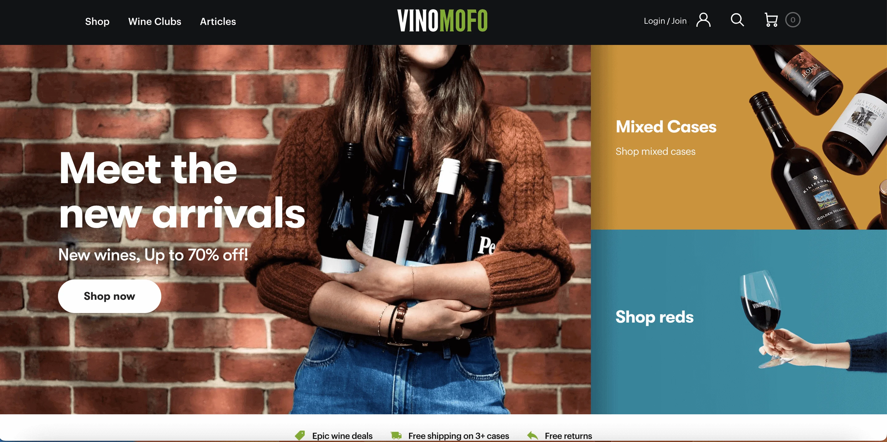 VinoMOFO online experience of a woman holding four bottles of wine against a brick wall.