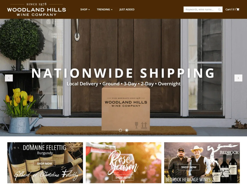 A Woodland Hills Wine Company box on a doorstep with flowers, plants, and text promoting nationwide shipping options.