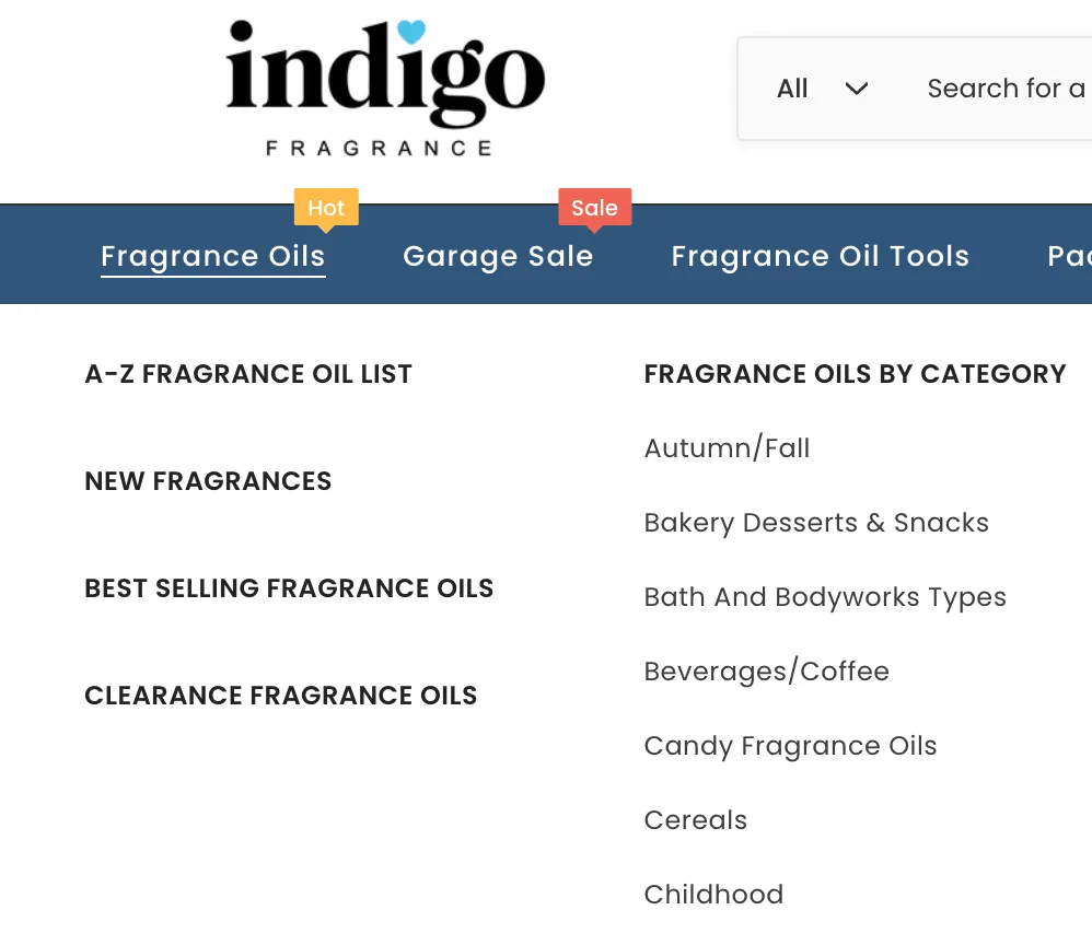 Indigo Fragrance logo with black text and blue heart above the 'i', with 'FRAGRANCE' written below in smaller letters.