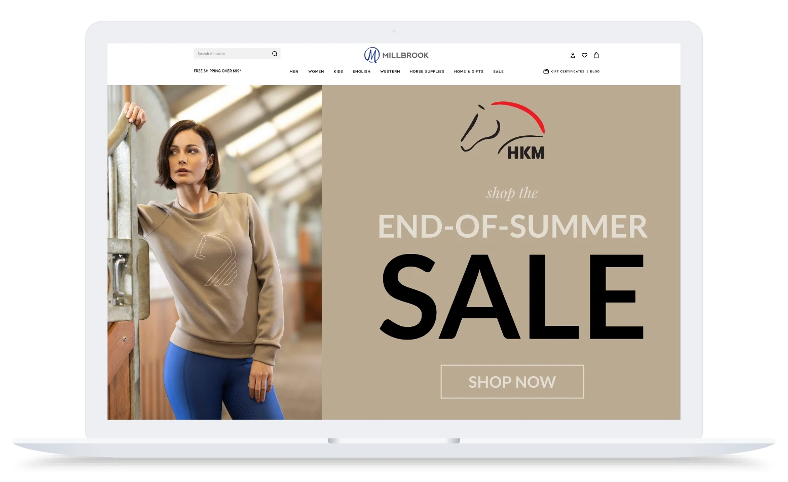 Woman in tan sweatshirt and blue pants stands in stable; large banner reads "End-of-Summer Sale, Shop Now" with HKM logo.