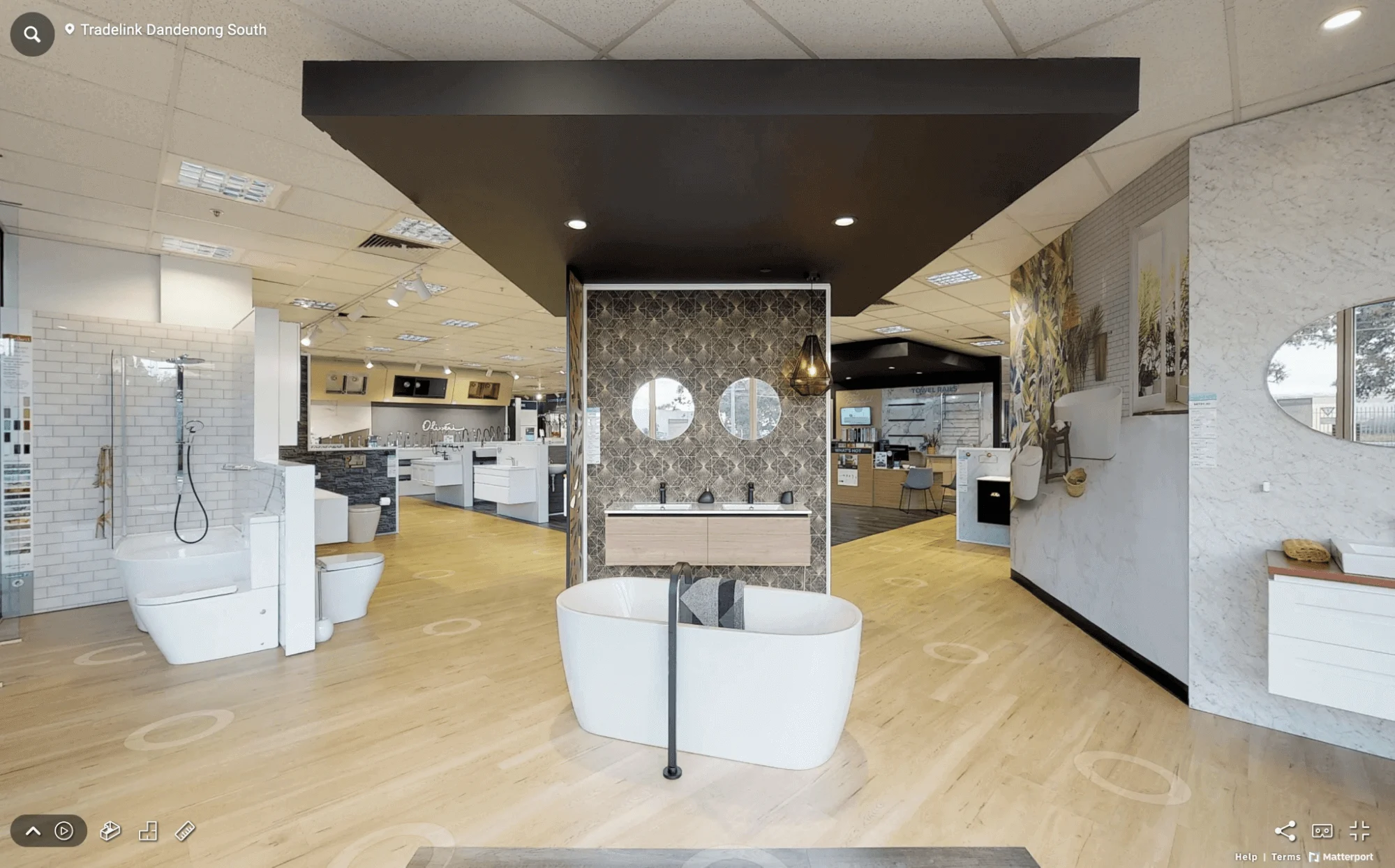 Interior view of the Tradelink Dandenong South showroom, featuring luxury bathtubs, vanities, and bathroom displays.