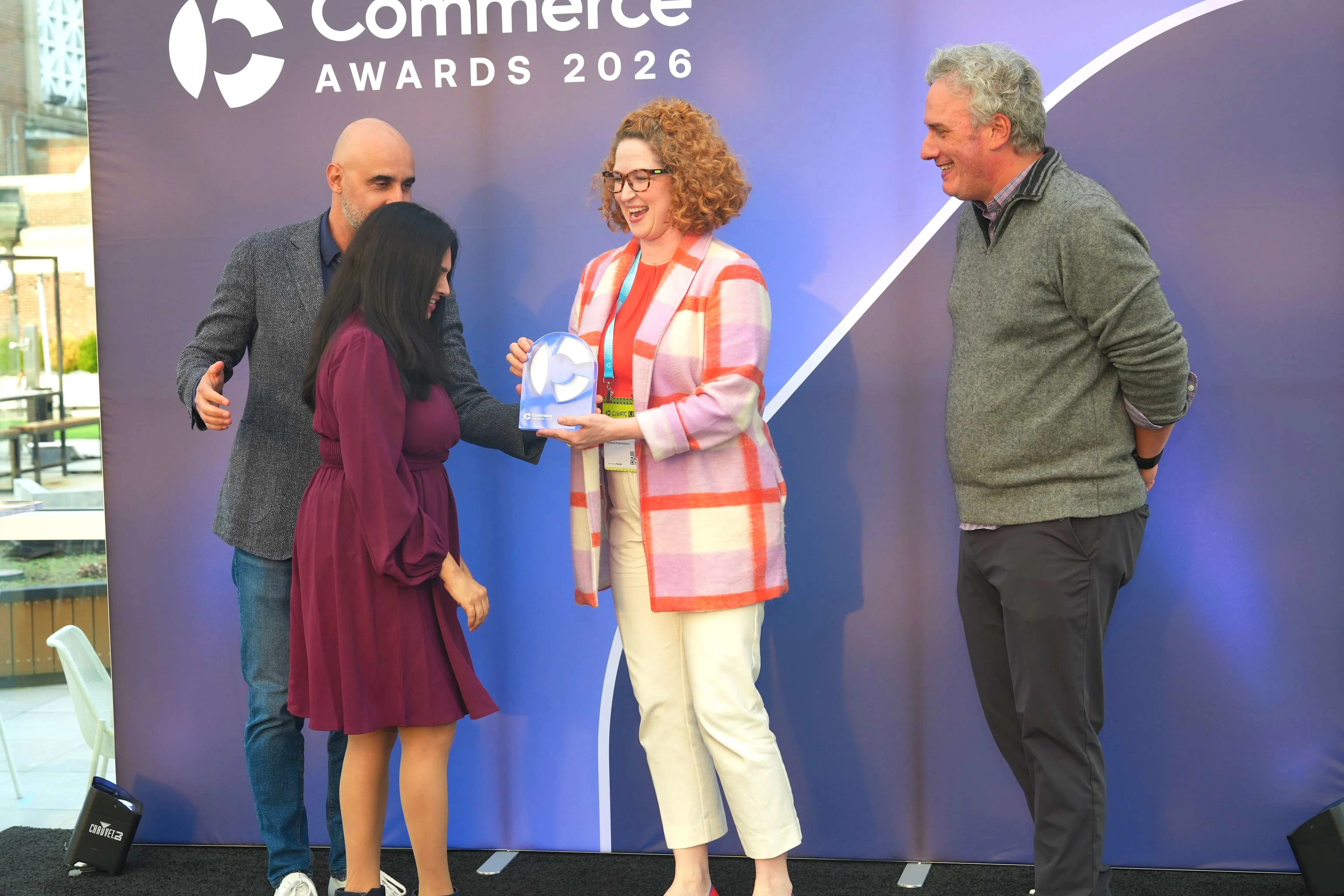 Taylored Expressions accepting the Emerging Innovator award from Commerce.