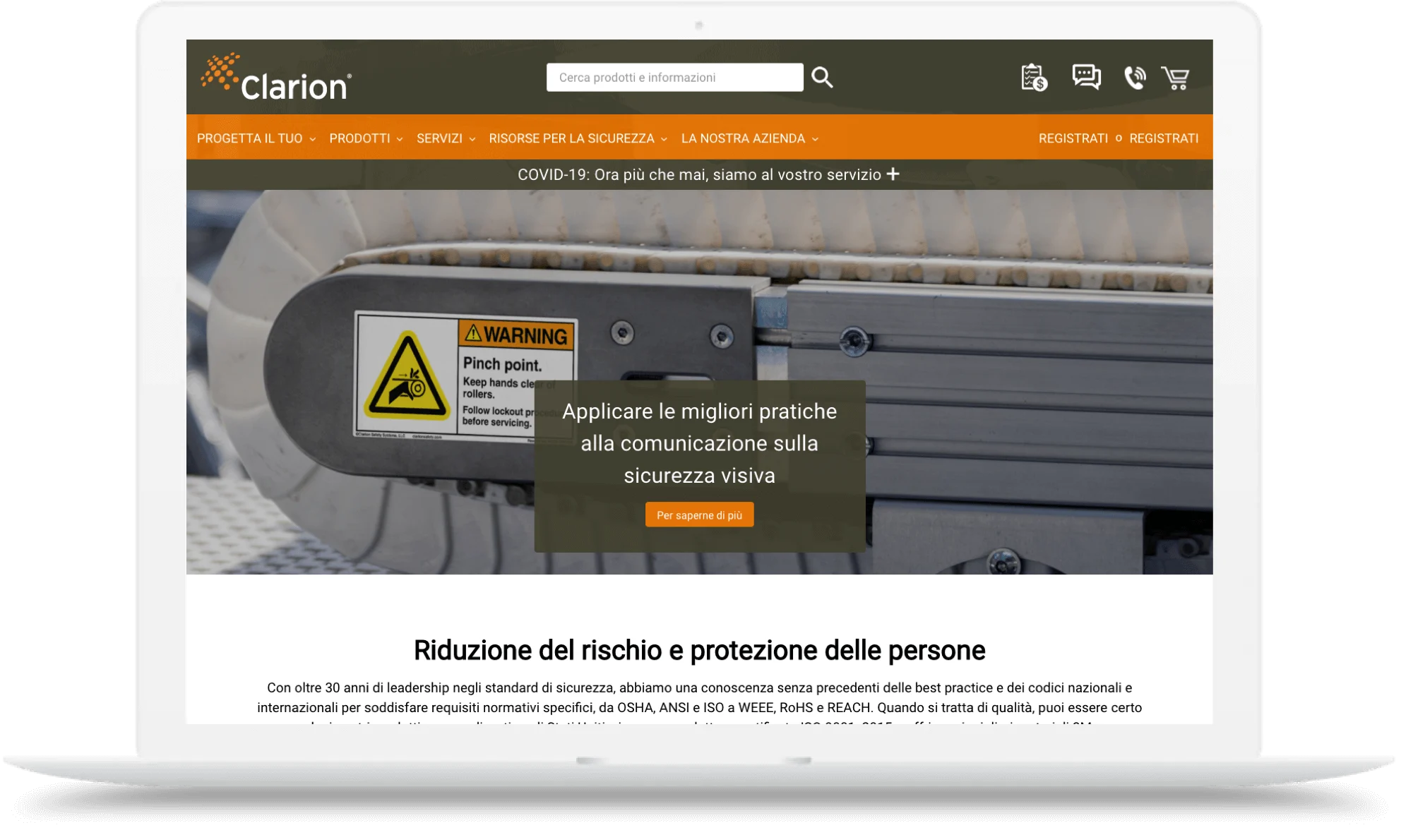 Laptop displaying a website with a machine warning label, navigation bar, and Italian safety communication text.