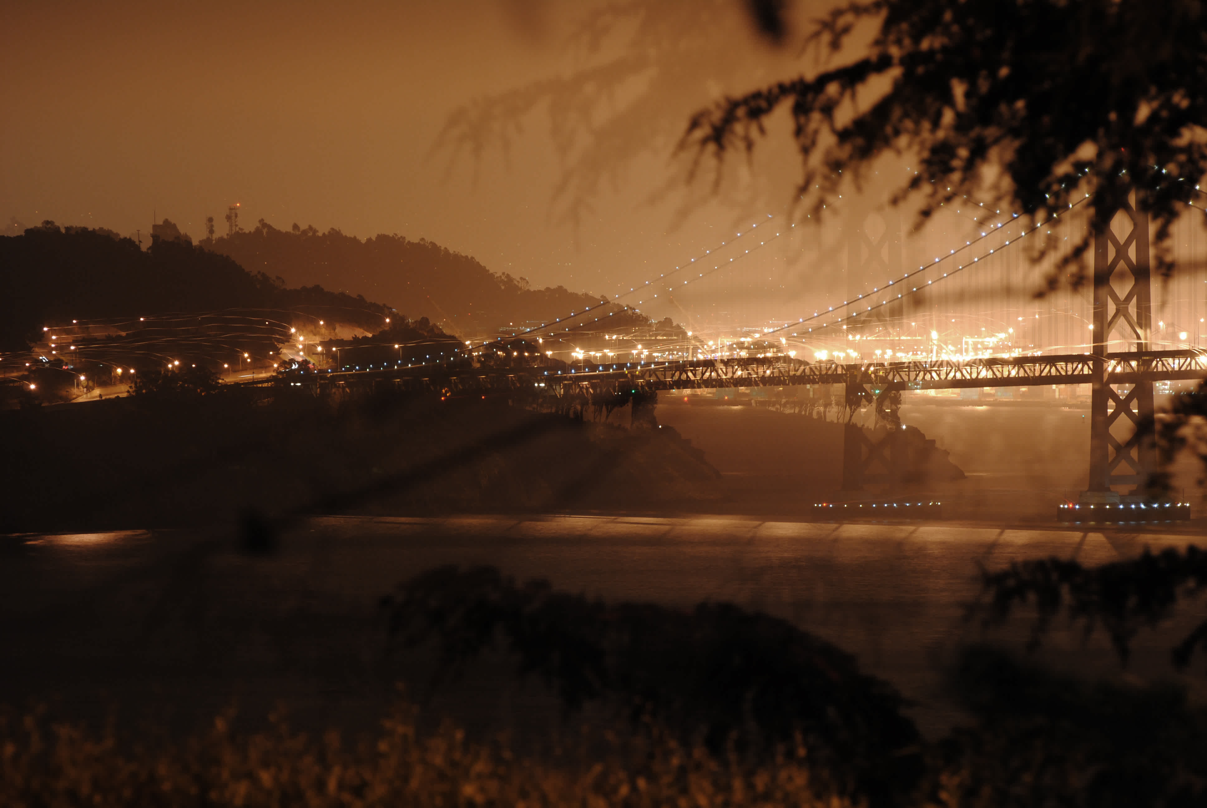Double exposure photograph of the Golden Gate Bridge at night in Golden Gate Bridge, San Francisco, California.