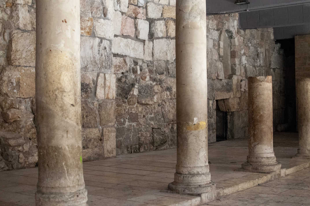 Columns  by a stone wall in the City of David in Jerusalem, Israel