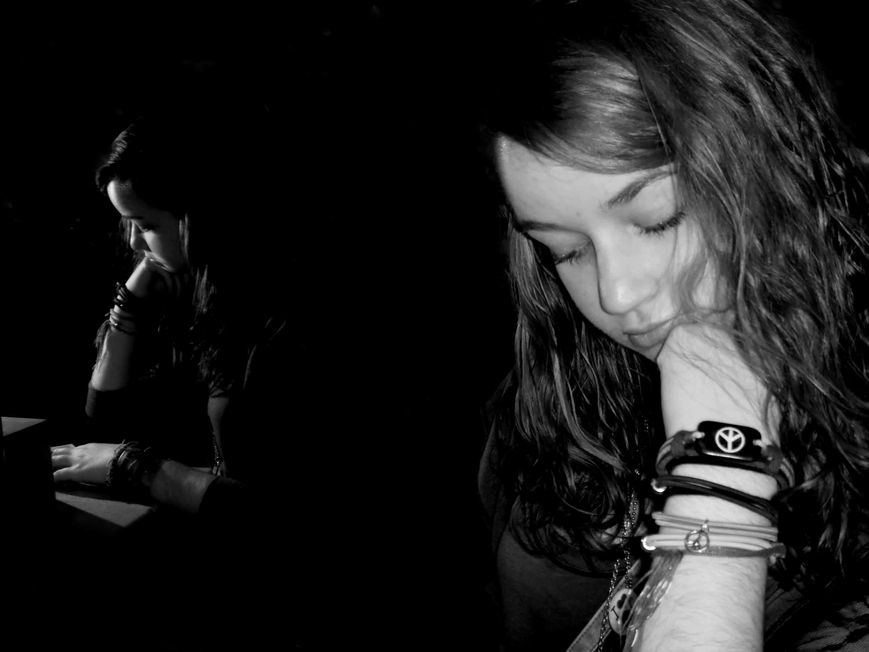 Girl with bracelets looking thoughtful
