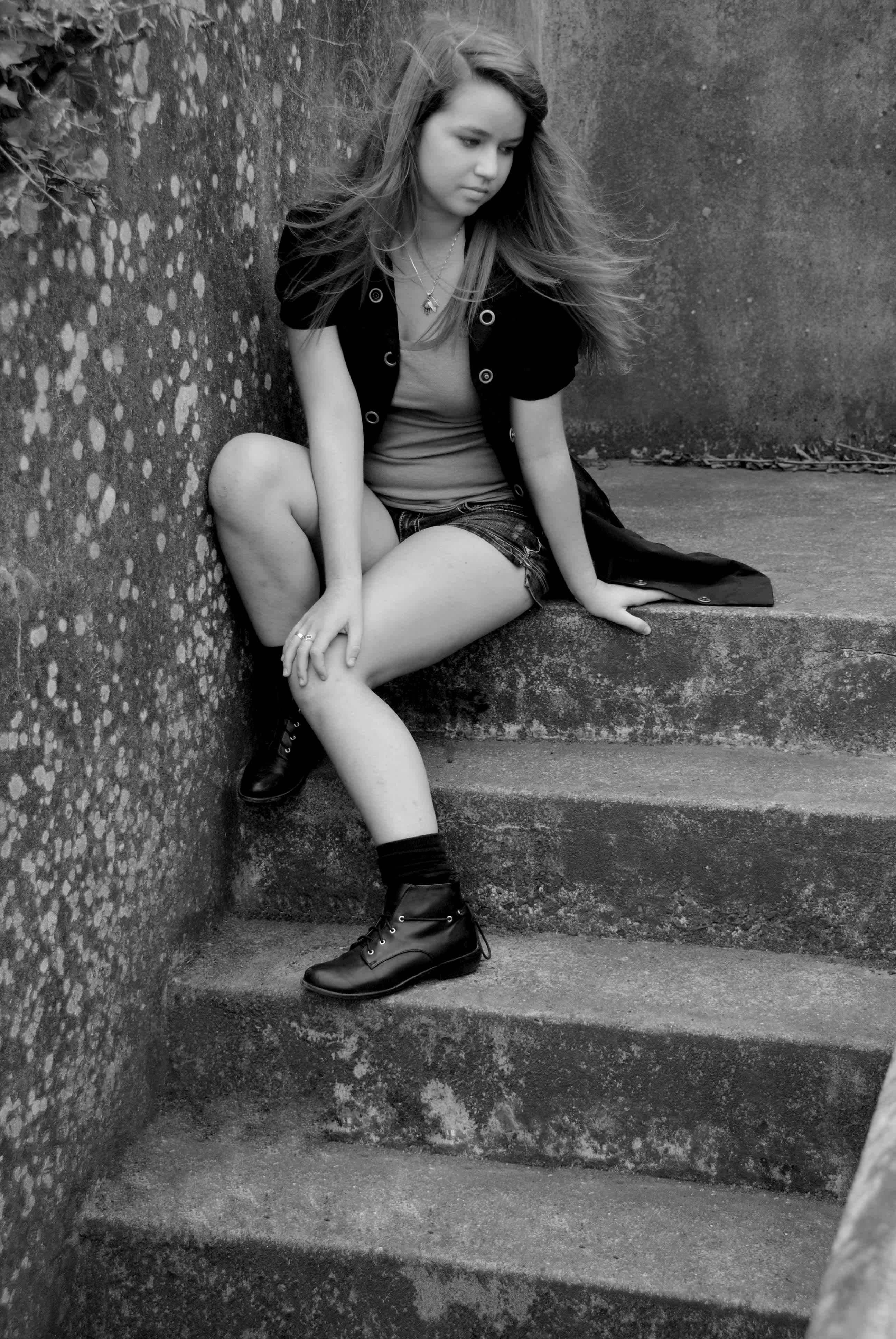 Black and white sitting on steps.