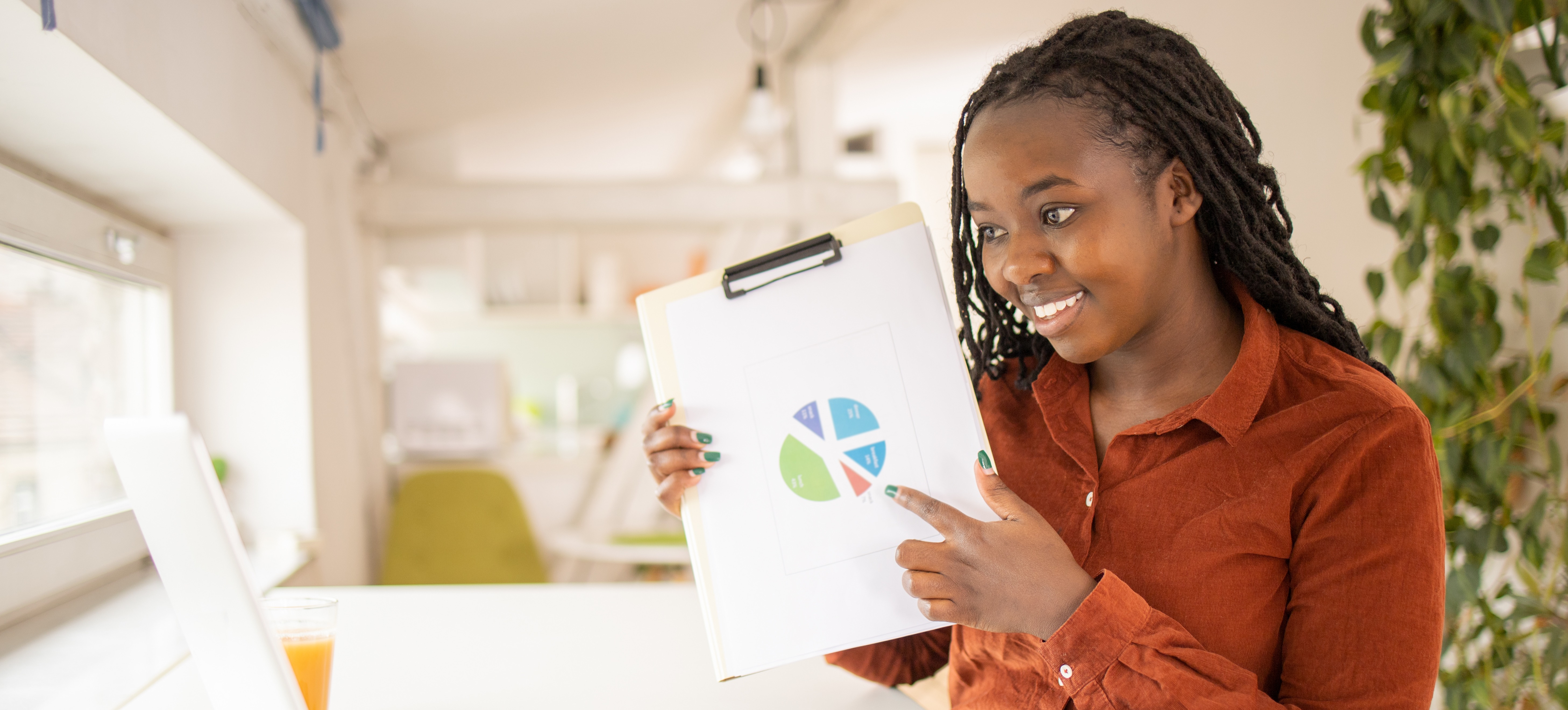 [Featured Image] A statistician sits in a remote meeting, sharing data they have gathered.
